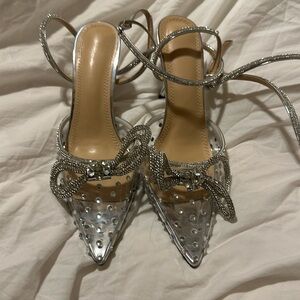 Brand new. Never worn. Strap goes up the ankle.